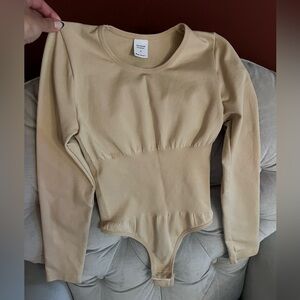 Beige bodysuit with cinched waist, never worn